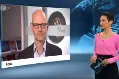 Screenshot from TV interview with moderator on the right and screen showing Niklas H&ouml;hne on the left