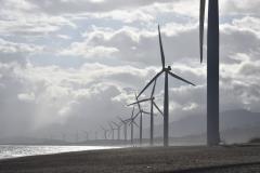 Windmills on seashore (Photo by Jem Sanchez via Pexels)