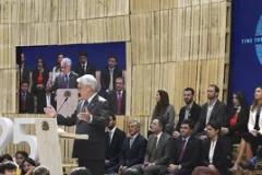 COP25 inaugural session showing people on stage while one is presenting. The COP25 banner is in the background.